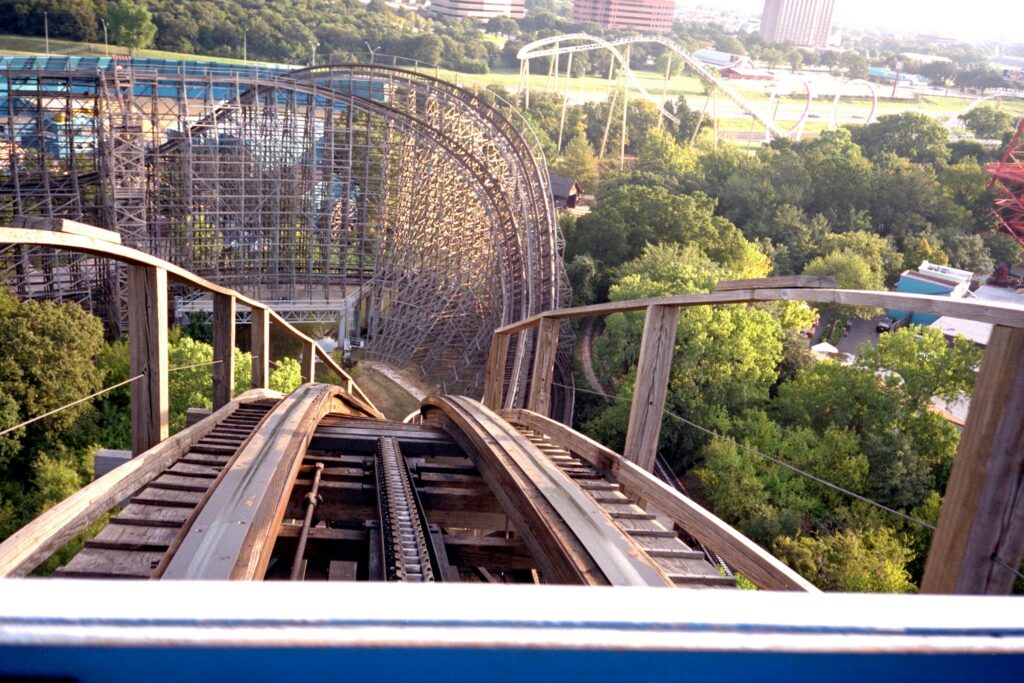 Experience the thrill of a wooden roller coaster at Arlington's iconic amusement park.